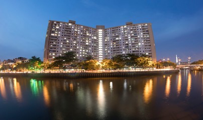 Naklejka premium Art photo: 18-storey apartment at sunset (Vietnam)
