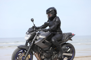 Fototapeta na wymiar young girl on a motorcycle