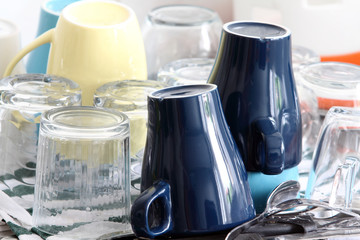 hygiene and cleaning - dishes, cups and glasses washed and placed to dry on the sink