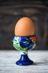 Boiled egg on dark wooden background