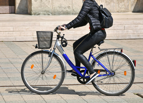 Woman rides a bicycle in the city