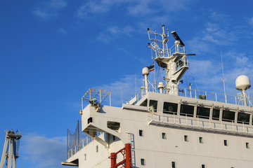 Shipyard The bulk carrier general cargo ship in dry dock yard, navigation bridge deck, recondition...