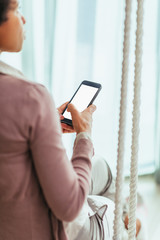 Texting from the comfort of her home