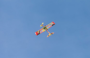Fototapeta na wymiar A model airplane on blue sky background
