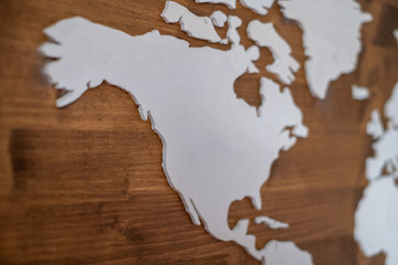 Handcrafted wooden world map with focus on US and Canada West Coast
