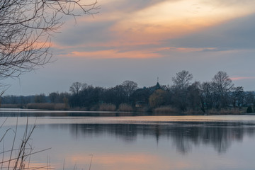 Autumn evening landscape with sunset and clouds over the recom in Zhuravlevsky Hydropark