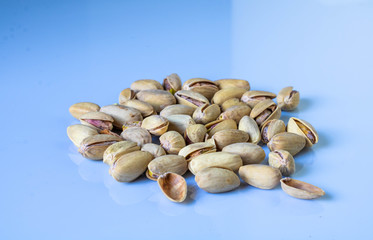 Pistachios isolated on a white background, top view.