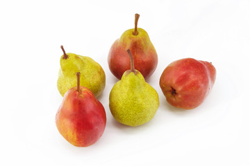 On a white background in the center are fresh ripe fruit in the amount of five pieces. Red and green pears