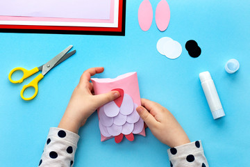 Making a cute owl pillow-box from colored paper. Children's art project. Step by step photo instruction. Step 6. Glue the beak part