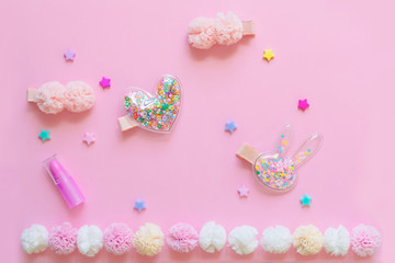 Obraz na płótnie Canvas Bright children's hair accessories on a pink background. Pink text background with children's hair ornaments