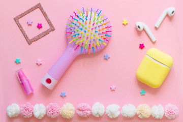 Bright children's hair accessories on a pink background. Pink text background with children's hair ornaments