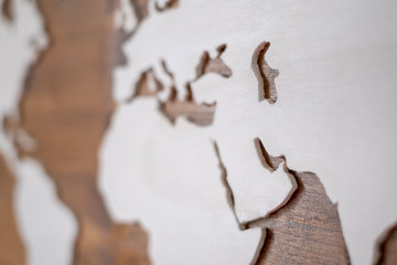 Handcrafted wooden world map with focus on the Arab Peninsula and the Persian Gulf