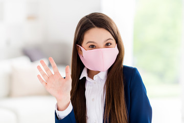 Closeup photo of little pretty student school girl stay home social distancing quarantine continue studying 1 september at home wear facial flu cold mask living room house classroom indoors