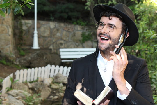 Cute Jewish man using old fashioned technology