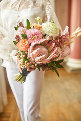 A wedding bouquet in bride hand