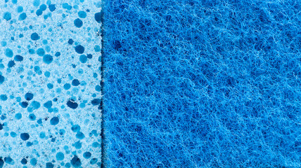 Background in the form of a porous structure in blue. Macro sponge. Close up blue sponge surface for textured background. copy space.