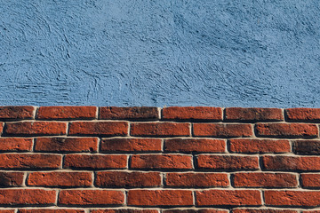 aged brick wall and blue concrete background for construction design