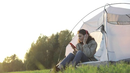 Camping woman lying in tent