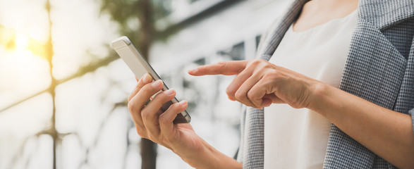 Close up. Young asian woman using smart phone. searching or social networks concept.