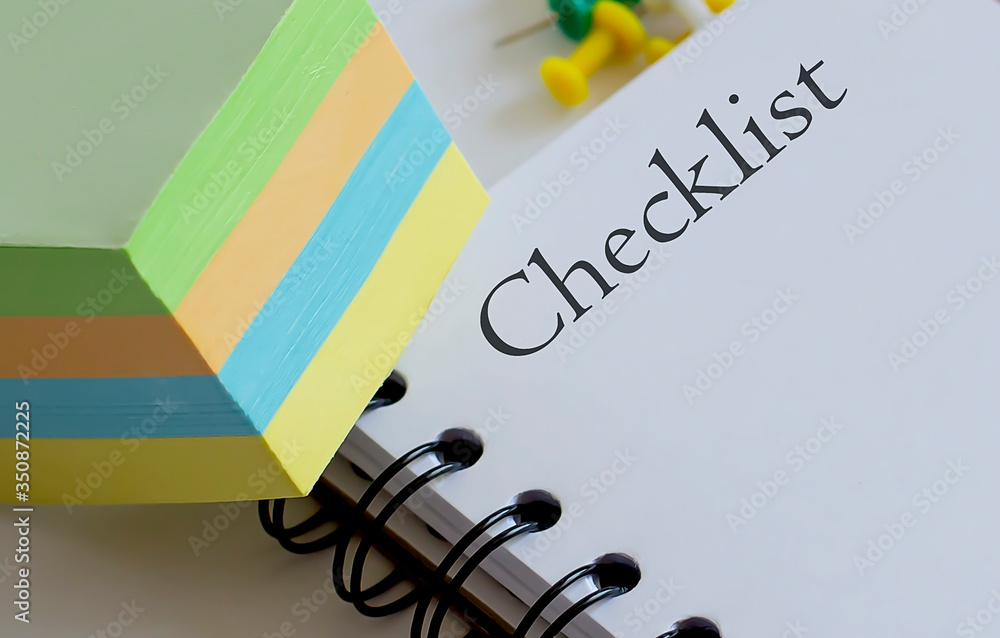 Poster checklist .desk with stationary and notebook with text and stickers.