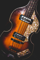A beautiful guitar with a black background.