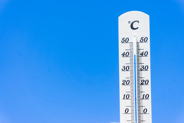 thermometer and sky, heatwave in summer