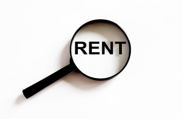 Magnifier with text Rent on the white background