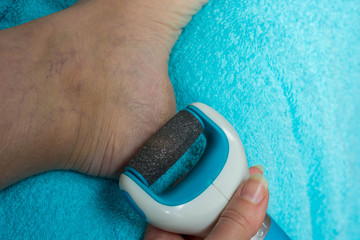 Care and cleansing of the feet from rough, flaky skin. An electric sander with a diamond pedicure...