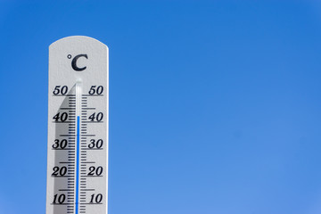 thermometer and sky, heatwave in summer