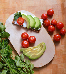 Vegetables tomatoes, avocado and greens for sandwiches