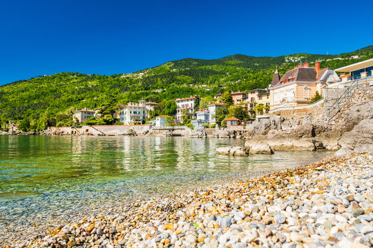 Beautiful Adriatic sea in Croatia, town of Lovran riviera, coastline villas in Kvarner bay