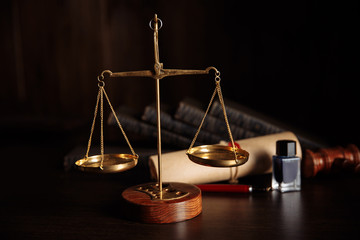 Law concept. Judge's gavel and libra in courtroom library.