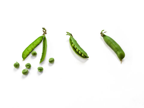 Three forms of green pea fruit: whole pod, open pod and seeds healed from the pod. The concept of natural food, vegetables close-up isolated on a white background