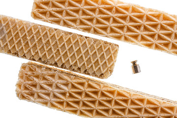 Three sweet rectangular shaped waffles and 2 grams metal weight or dumbbell isolated on white...