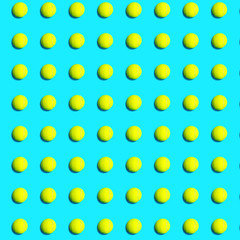 Trendy pattern made of tennis ball on blue green mint background. Sport tennis layout. Flat lay.