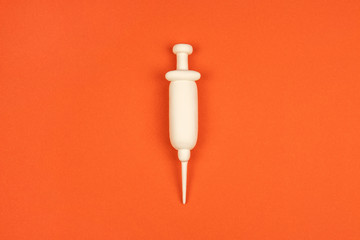 Syringe, 3d mock-up element on red background. Vaccination concept. Intramuscular or intravenous...