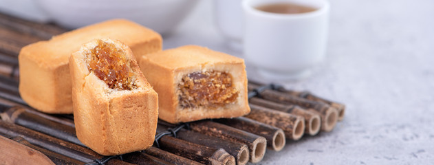 Pineapple cake pastry - Taiwanese famous sweet delicious dessert food with tea, close up, copy space design.