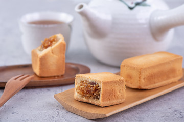 Pineapple cake pastry - Taiwanese famous sweet delicious dessert food with tea, close up, copy space design.