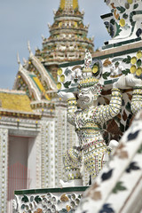 Fototapeta premium The sculpture of Guardian giant decorate at Prang building in Wat Arun Ratchawararam Ratchawaramahawihan (After big renovate)