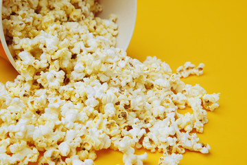 Popcorn border isolated on yellow background. Film. Fast food.