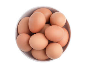 Top view chicken eggs in the white bowl isolated