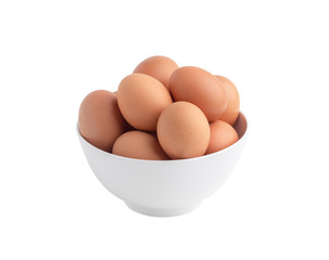 Raw chicken eggs in the white bowl isolated