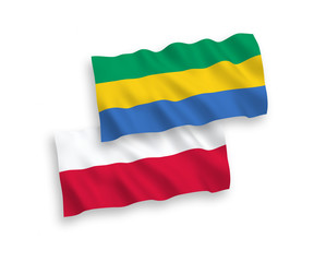 Flags of Gabon and Poland on a white background