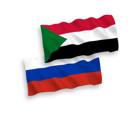 Flags of Sudan and Russia on a white background