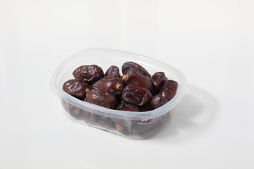 Dried dates fruits on white background, tasted sweet and chewy