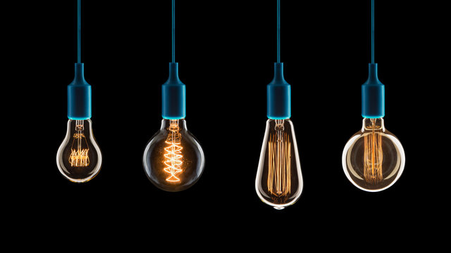 Idea and teamwork concept - Vintage incandescent bulbs on black background