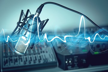 Microphone and digital studio mixer on background