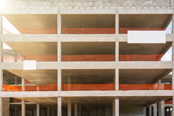 Frame of a building under construction. Multi-story building. Construction in progress.