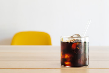 cold brew coffee on white wooden table.