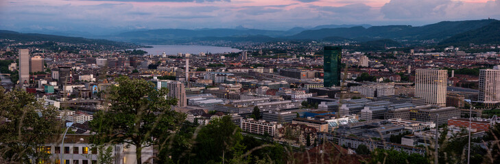 Fototapeta na wymiar Zurich city Switzerland panorama from famous vista point in the evening after sunset cloudy sky